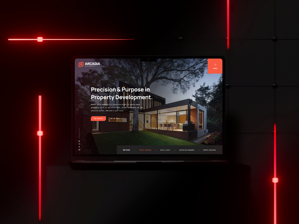 Modern property development website displayed on laptop